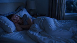 person in bed at night unable to get comfortable shifting positions